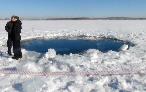 The 20-foot (6-meter) hole punched through the ice on Chebarkul Lake by a large fragment of the Chelyabinsk meteorite. Credit: AP